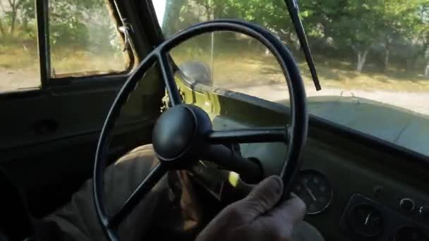 Old grandfather goes on a retro pickup truck. — Stock Video
