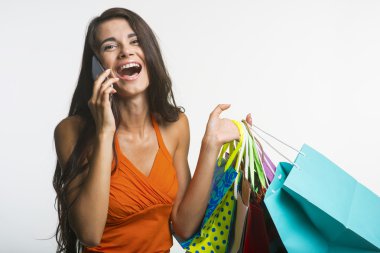 Surprised woman on shopping seasonal discounts.