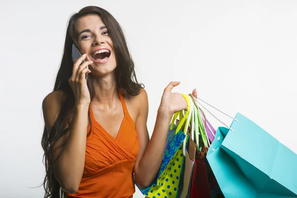 Surprised woman on shopping seasonal discounts. — Stok fotoğraf