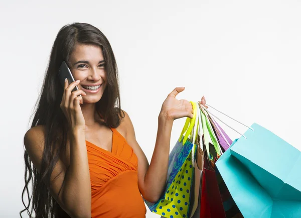 Merry woman on shopping during seasonal discounts. Stock Image