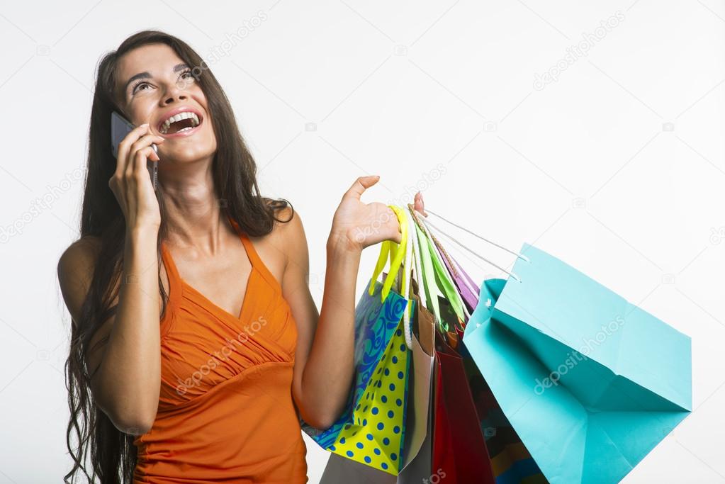 Merry lady on shopping during seasonal discounts.