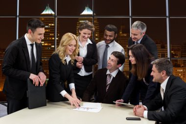 Business people on the background of the night city.