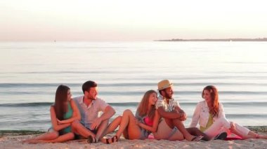 Young people meets sunrise of the sea.
