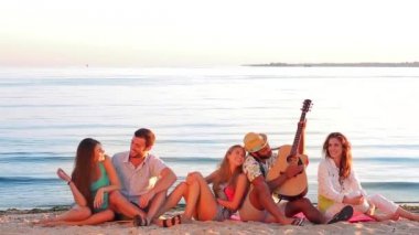 Youth emotionally sings and plays guitar.
