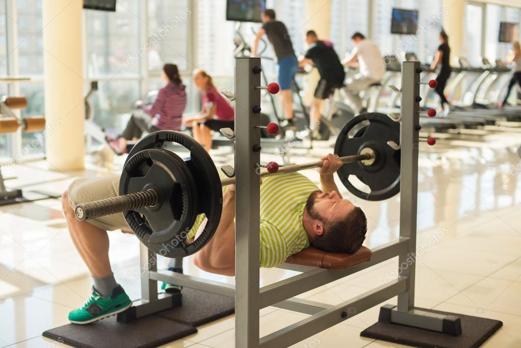 Sportsman with barbell.