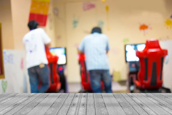 Arcade gioco macchina negozio sfocatura sfondo con immagine bokeh — Foto Stock