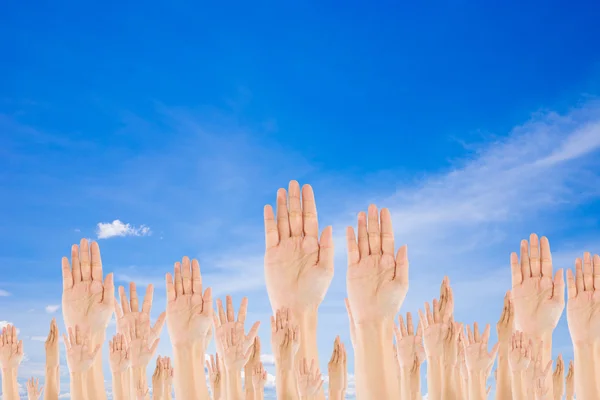 Diverse Raised Hands on sky background — Stock Photo, Image