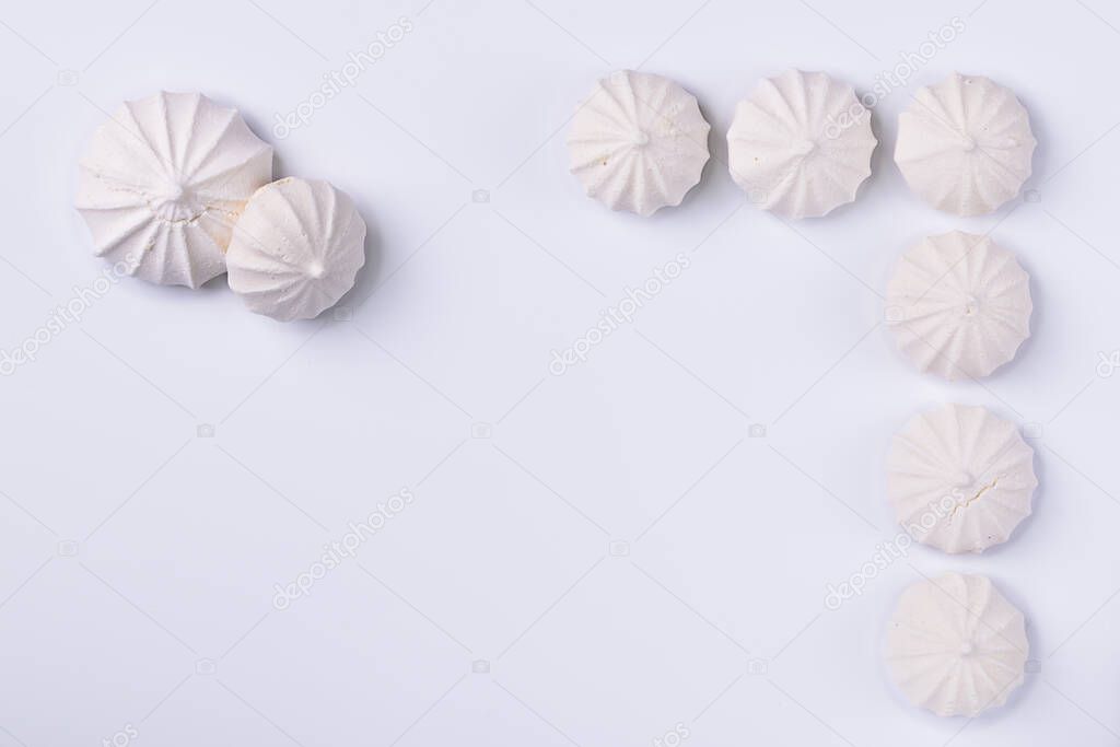 Meringue cookie on white background, for backgrounds or textures , copy space.