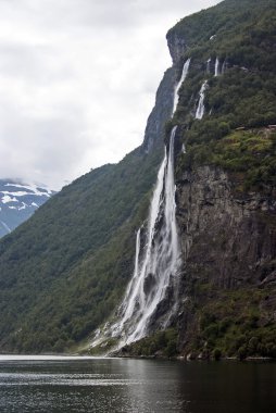 Tourism vacation and travel. Mountains and waterfall on fjord Nærøyfjord in Gudvangen, Norway, Scandinavia.