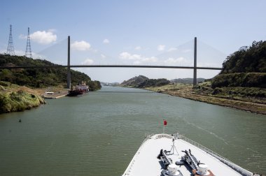 Cruise ship bow passing Panama Canal near the bridge. clipart