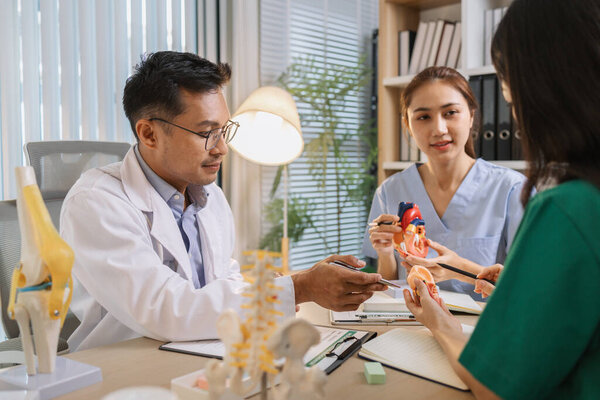 Medical professionals collaborating during a meeting to discuss patient care plans and treatment strategies. Doctors and nurses share expertise and analyze clinical data for better healthcare outcomes