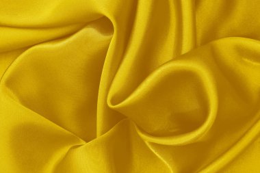 Altın sarısı kumaş dokusu arka plan, ipek ya da keten desenlerin ayrıntıları.