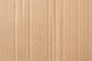 Karton yaprak dokusu arka planı, geri dönüşüm kahverengi karton kutu deseninin ayrıntıları.