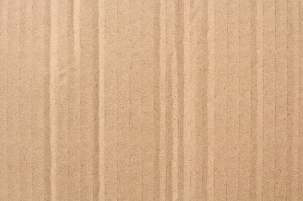 Karton yaprak dokusu arka planı, geri dönüşüm kahverengi karton kutu deseninin ayrıntıları.