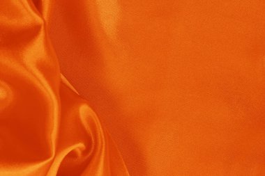 Turuncu kumaş dokusu arkaplanı, ipeğin veya keten deseninin ayrıntıları.