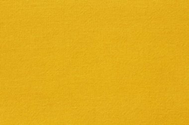 Arka plan için altın sarısı pamuk kumaş kumaş dokusu, doğal tekstil deseni.