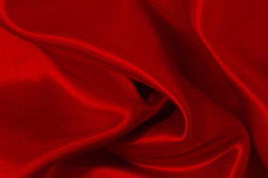 Koyu kırmızı kumaş dokusu arka plan, ipeğin veya keten deseninin ayrıntıları.