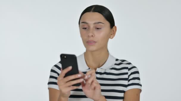 Smartphone use by Young Latin Woman, White Background — Stock Video