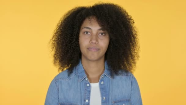 Young African Woman with Thumbs Down, Yellow Background — Stock Video