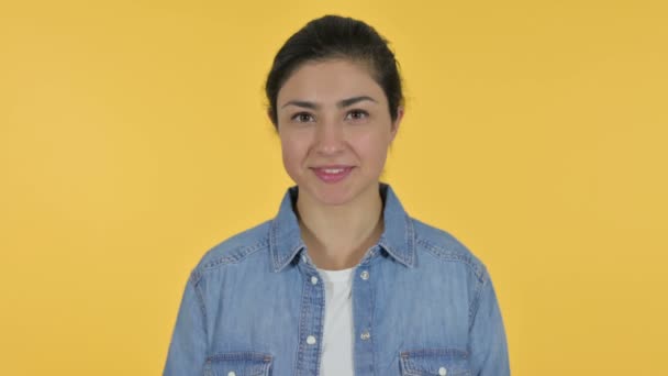 Young Indian Woman Smiling at Camera, Yellow Background — Stock Video