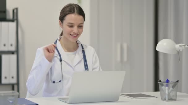Young Female Doctor Talking on Video Chat on Laptop — Stock Video