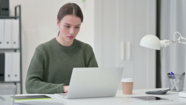 Young Woman with Laptop Drinking Coffee — Stock Video