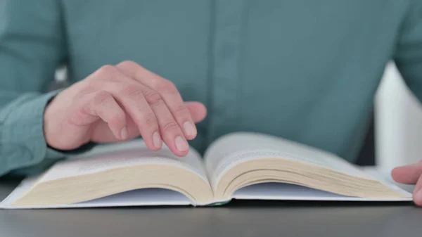 Close up of Man Reading Pages of Book — Stock Photo, Image