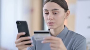 Close up of Latin Women Making Online Payment on Smartphone 