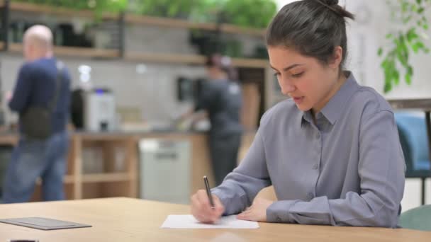 Young Indian Woman having Failure at Writing on Paper — Stock Video