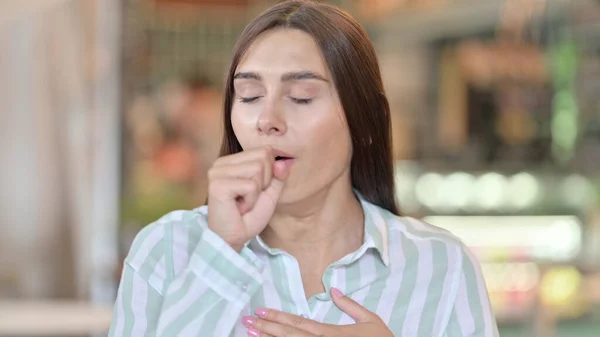 Sick Young Latin Woman Coughing, Throat Pain