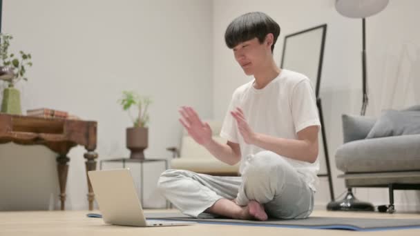 Asian Man using Laptop on Yoga Mat at at Home — стоковое видео