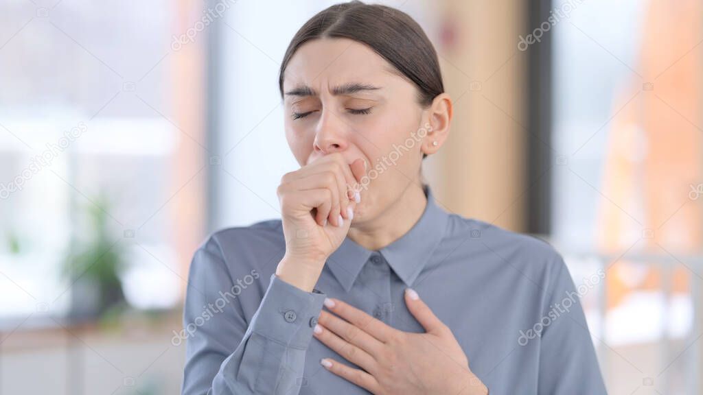 Portrait of Sick Latin Woman Coughing