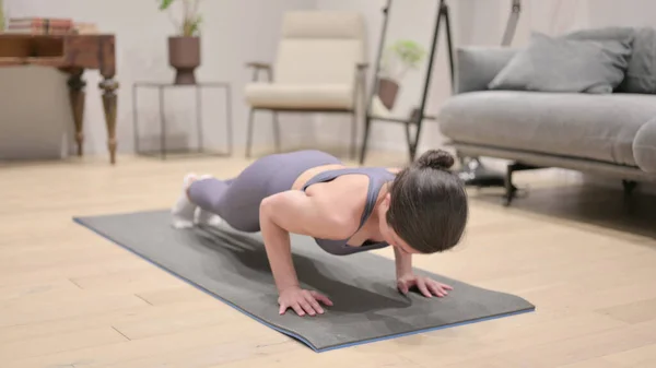 Tired Indian Woman doing Pushups at Home