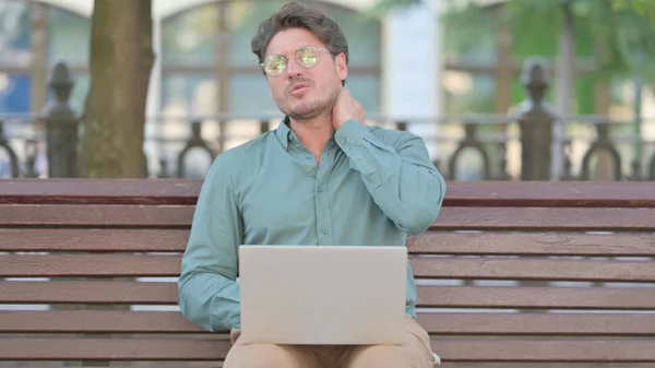 Man having Neck Pain while Typing on Laptop — Stock Photo, Image