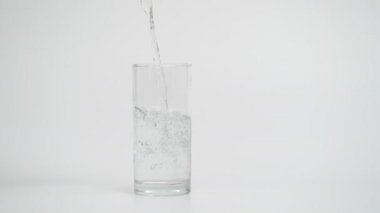 Slow Motion of Pouring Water in Glass with Ice, 1000 fps