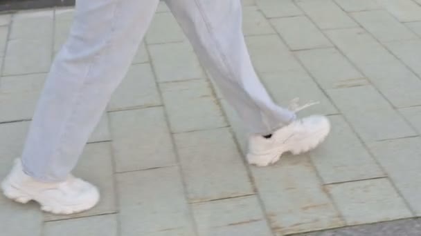 Close up Shot of Feet of Young Woman Walking on Pavement, Widok z boku — Wideo stockowe