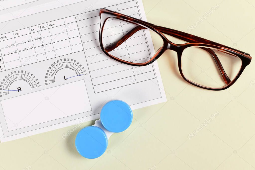 Medical eyeglass prescription with parameters, glases and contact lens container on yellow background