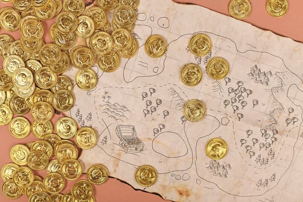Pirate treasure map with toy gold coins for children