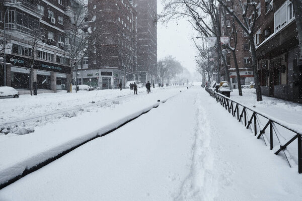 Madrid, Spain - January 9, 2021. Historic snowfall over the city in Arganzuela district.