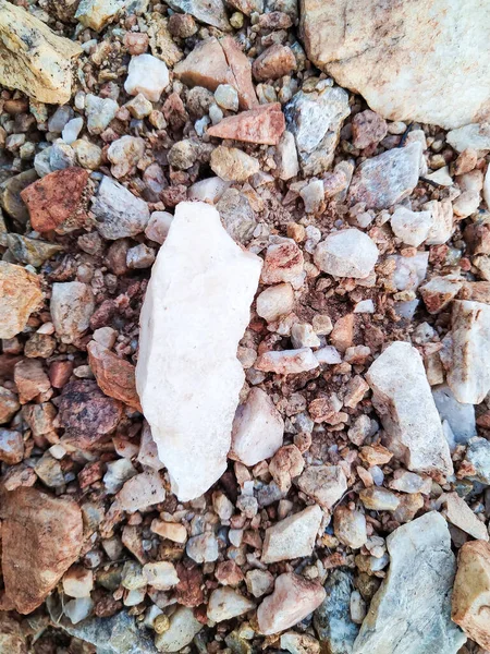 White rock found in between small stones