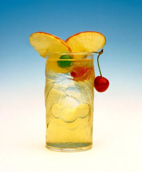 beverage alcoholic drink cocktail with cherry and apple on white and blue background