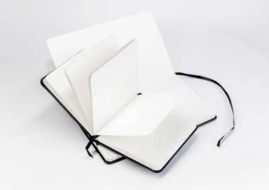 Two black unfold open notebooks with blank white pages and dark ribbons bookmarks. Minimalistic background clipart