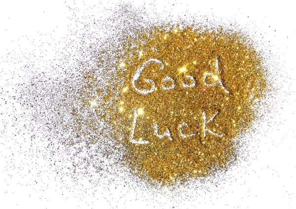Inscription Good Luck on golden glitter sparkle on white background