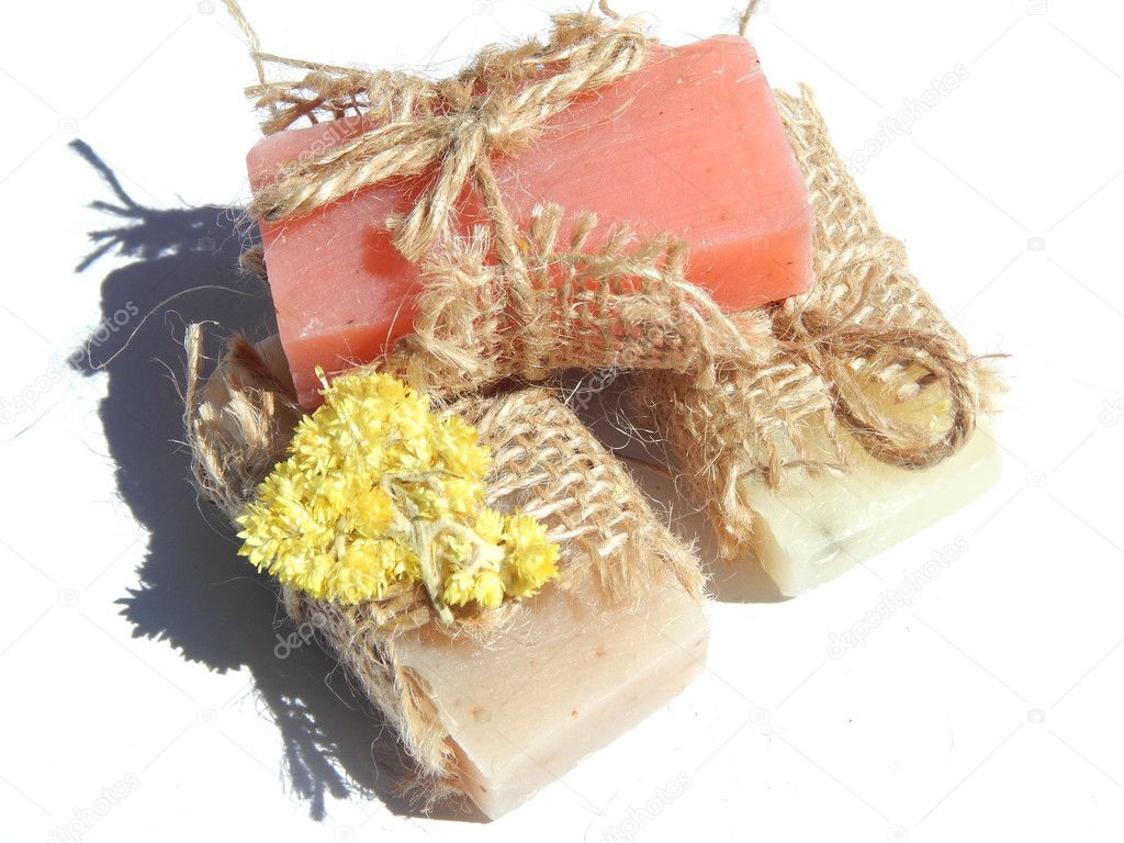 Three bars of soap with shadow on white background