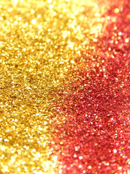 Onscherpe achtergrond van gouden en rood glitter sparkle — Stockfoto