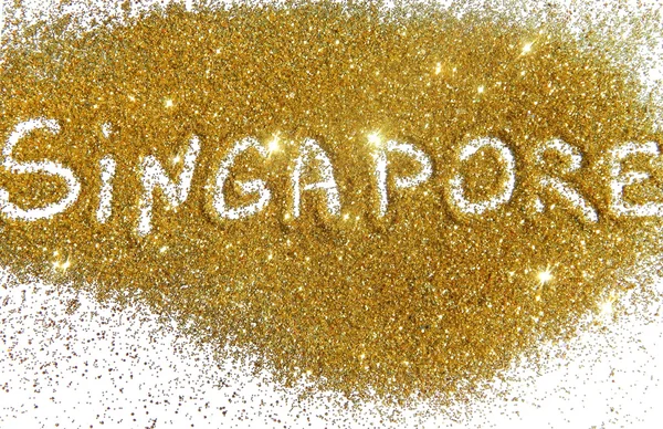 Inscription Singapore on golden glitter sparkles on white background