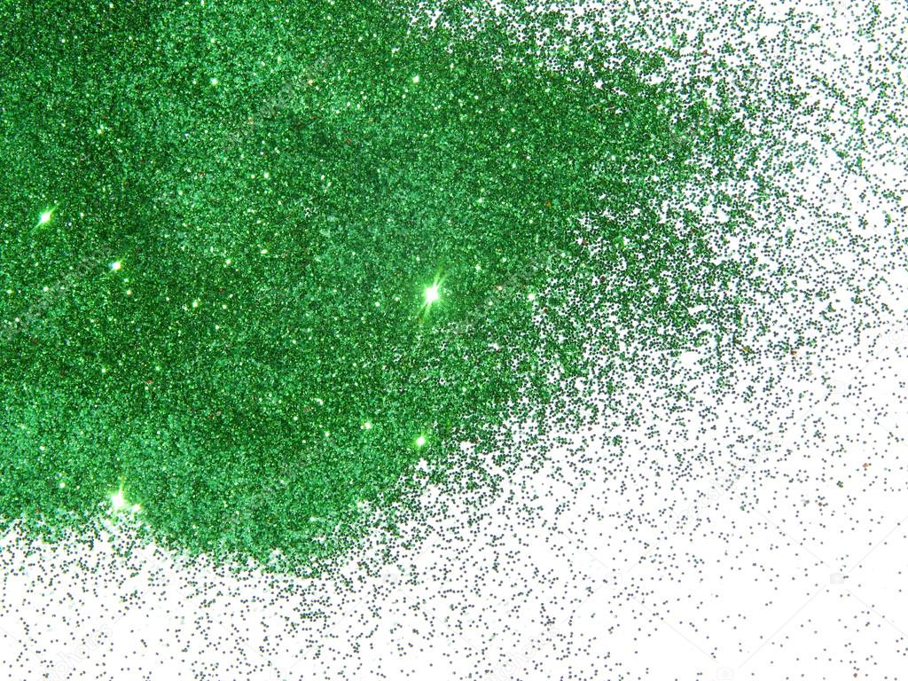 Green glitter sparkle on white background