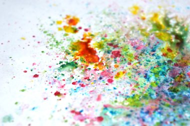 Abstract splashes of watercolor on bluish background clipart