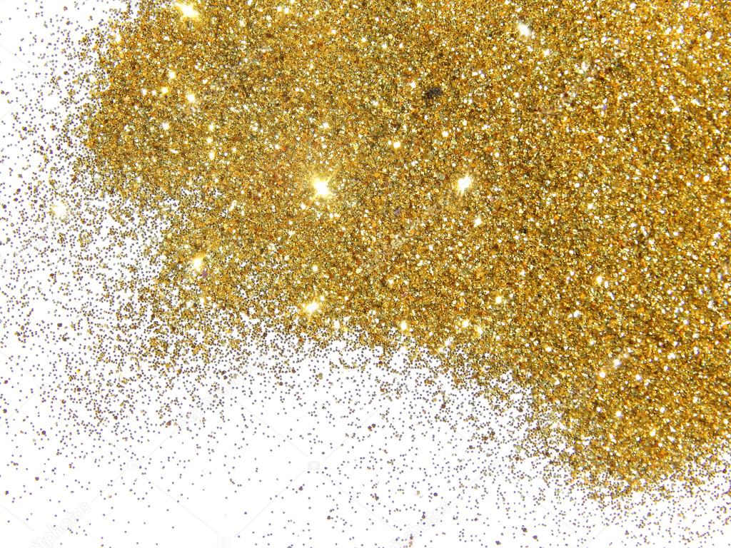 Golden glitter sparkle on white background