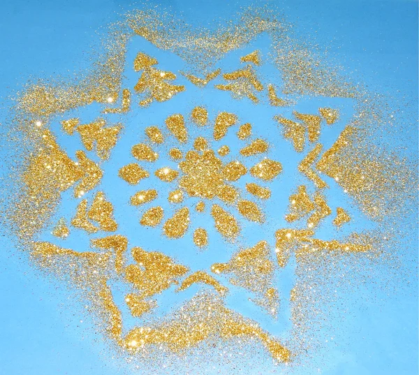 Θολή υπόβαθρο με νιφάδα χιονιού της χρυσή λάμψη λάμπει μπλε — Φωτογραφία Αρχείου